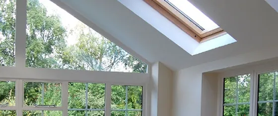 Inside a garden room extension: a glazed gable and a roof window